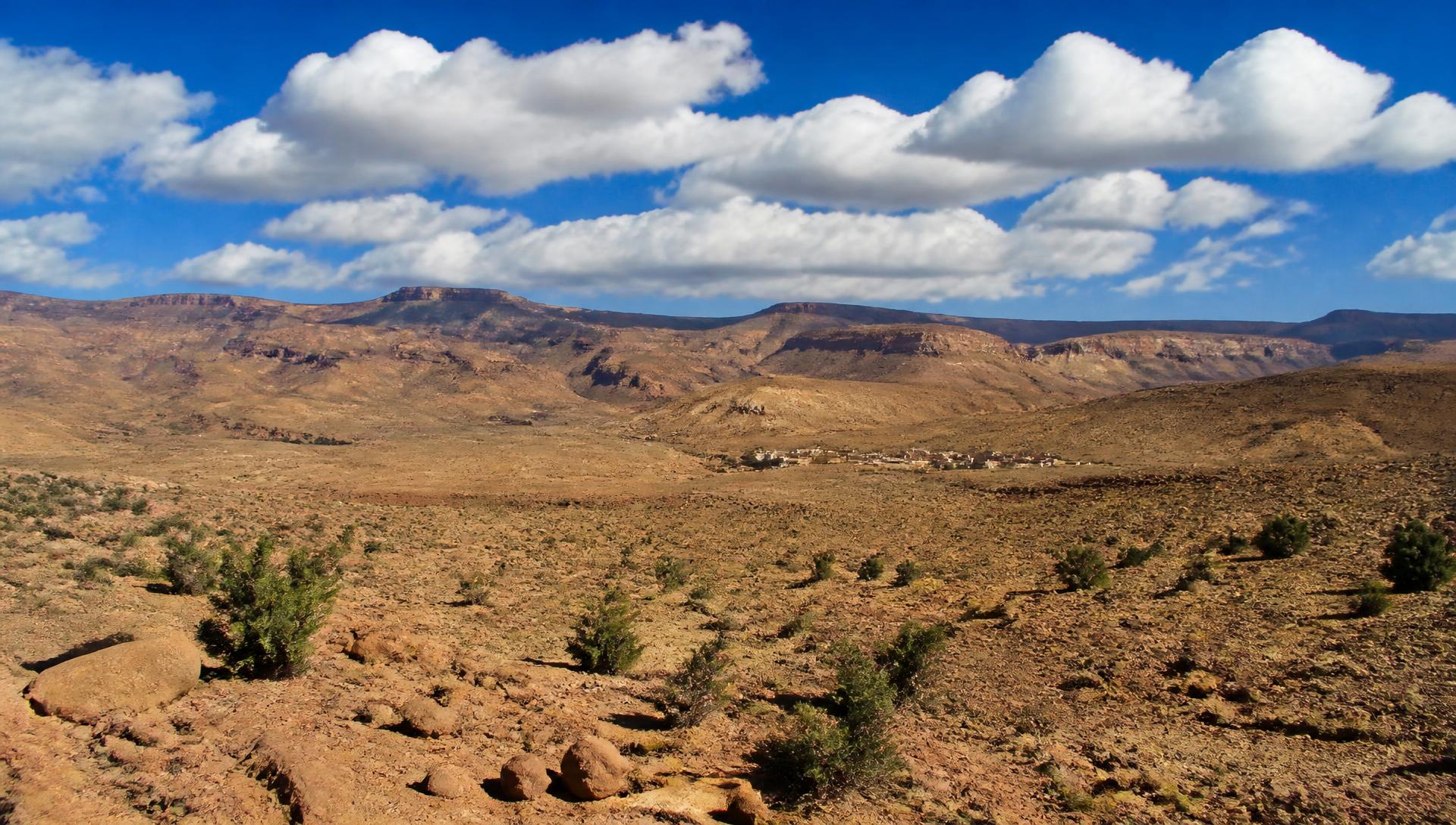 The arid Anti-Atlas mountains of Morocco under a bright blue sky